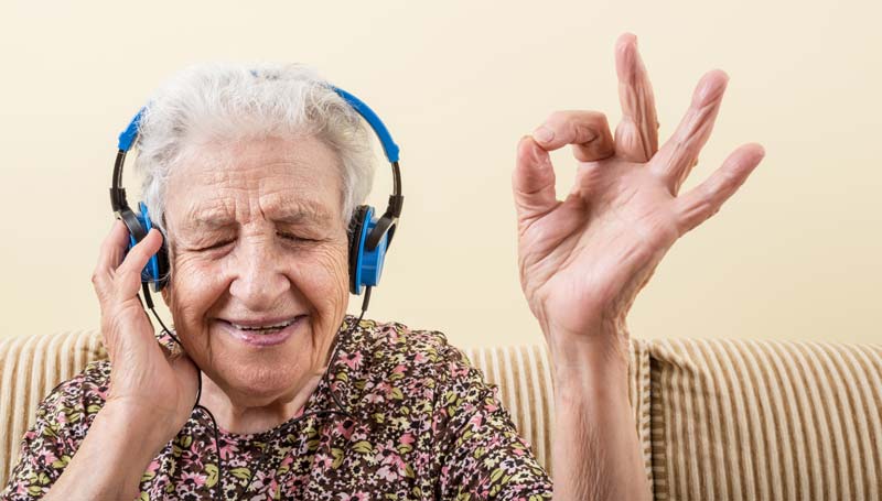 Grandmother feeling youthful listening to music